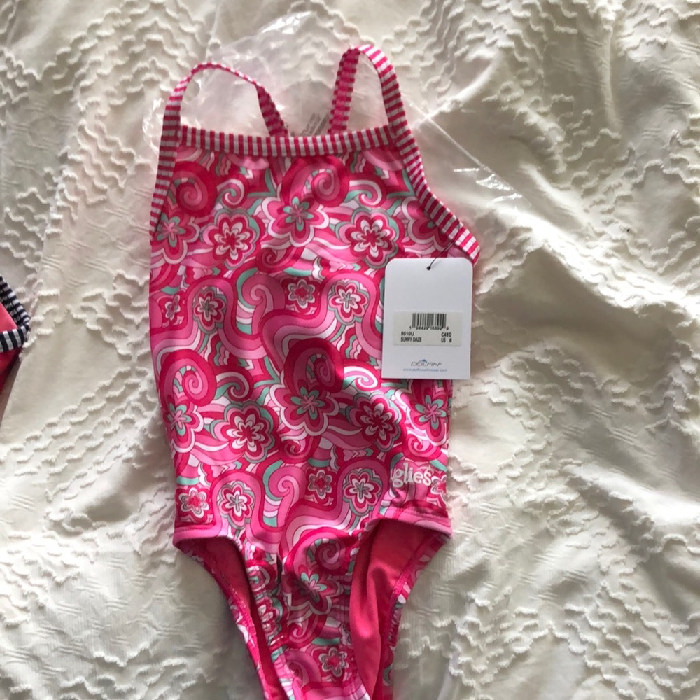 Girls Uglies size 8 one piece pink suit NWT never worn.